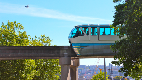 Side profile of the Seattle Center Monorail Blue Train on the elevated monorail track in Seattle, Washington