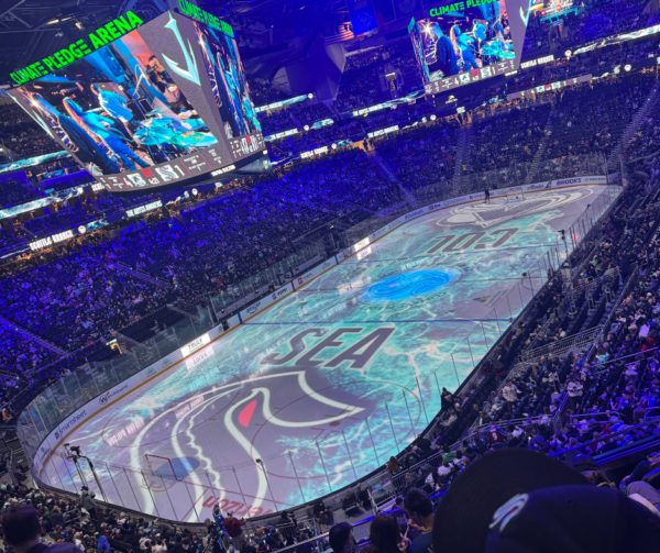 Colorful Lights Shining On Ice Rink in Climate Pledge Arena on Kraken Hocky Game Night