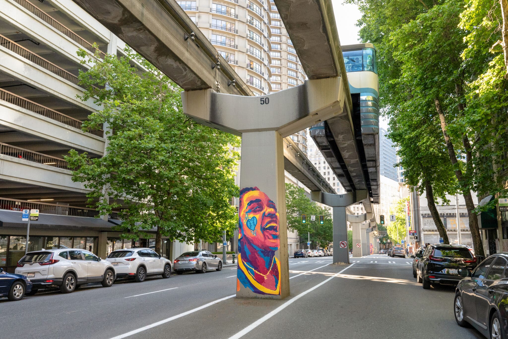 Seattle Sports fan mural with monorail running overhead